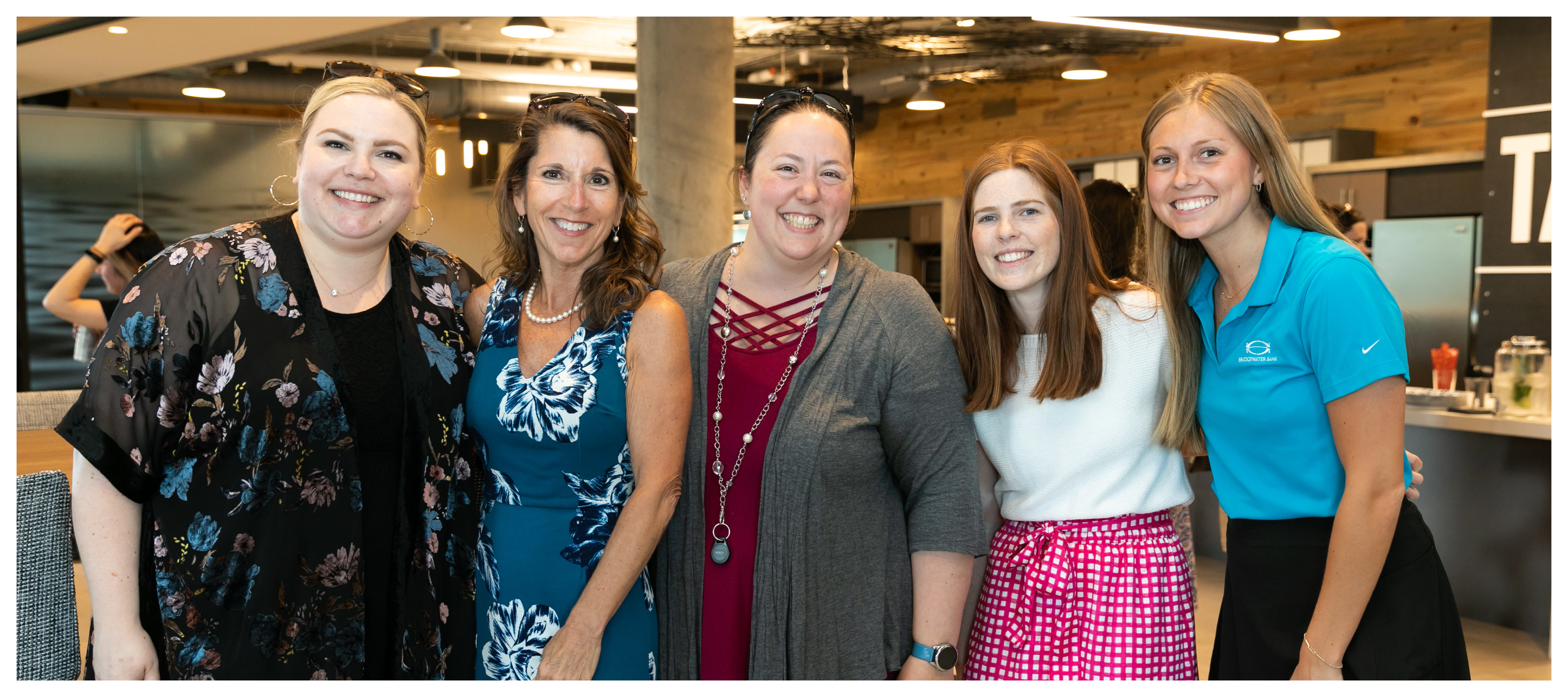 Group photo of MB Investment Group women at an internal happy hour.